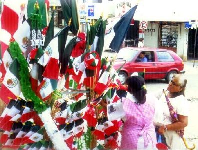 Flag sellers appear on street corners as Mexicans celebrate their national heroes